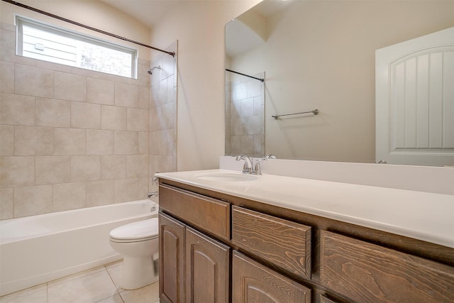 full bath with tile patterned floors, washtub / shower combination, vanity, and toilet