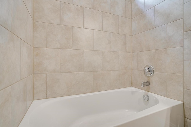 full bath featuring a tub to relax in
