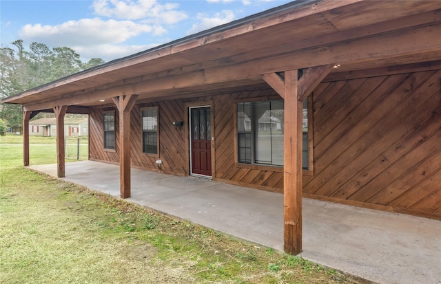 exterior space featuring a patio and a lawn