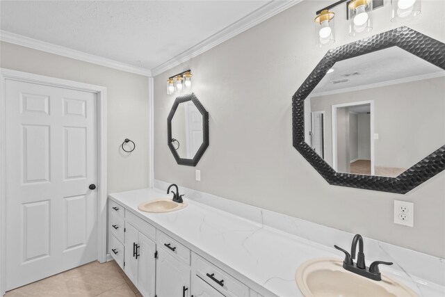 full bathroom featuring a sink, ornamental molding, double vanity, and tile patterned flooring