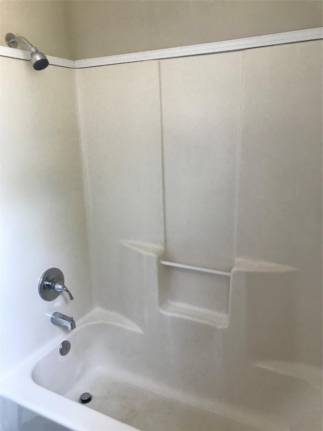 bathroom with shower / bathtub combination