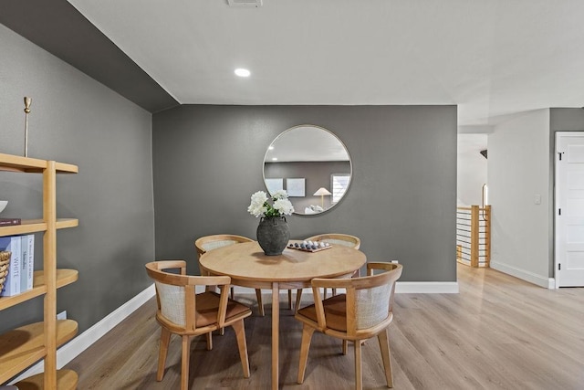 dining space featuring recessed lighting, visible vents, baseboards, and wood finished floors