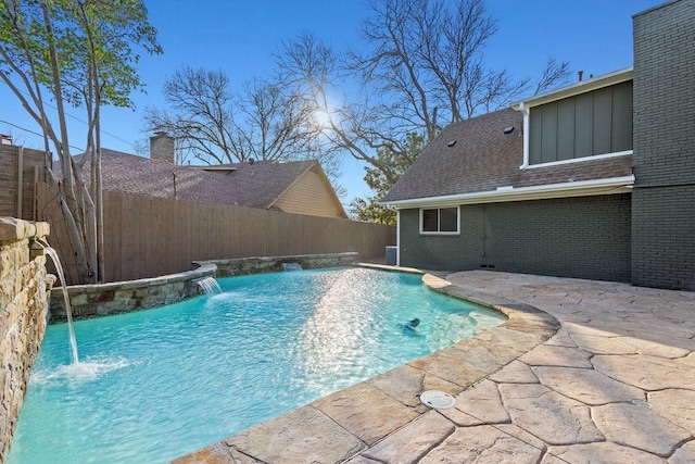 view of swimming pool with a patio area, a fenced in pool, and a fenced backyard