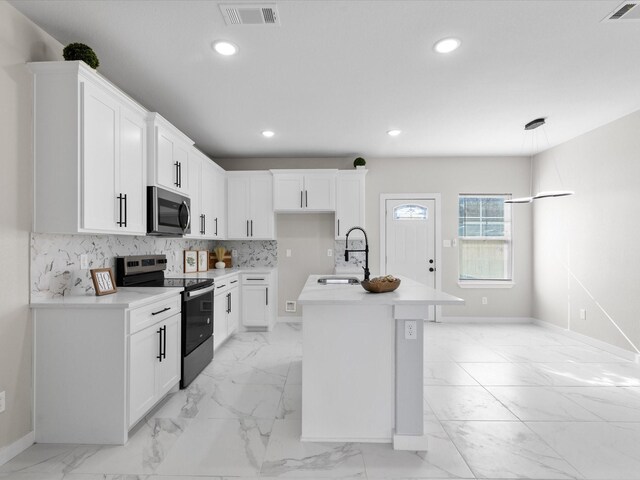 kitchen with visible vents, marble finish floor, stainless steel appliances, and a sink