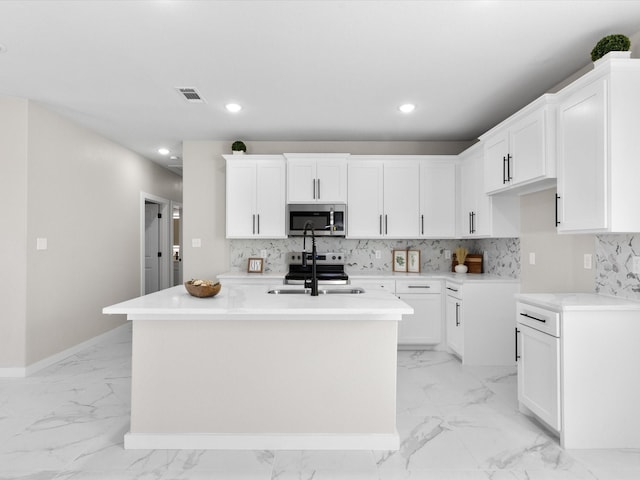 kitchen with visible vents, marble finish floor, a sink, backsplash, and stainless steel appliances