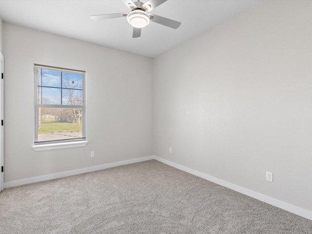 unfurnished room with baseboards, carpet, and ceiling fan