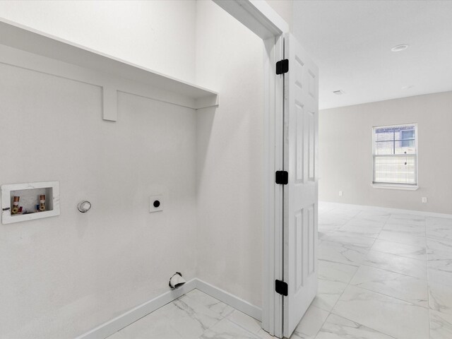 laundry room with baseboards, gas dryer hookup, washer hookup, laundry area, and marble finish floor