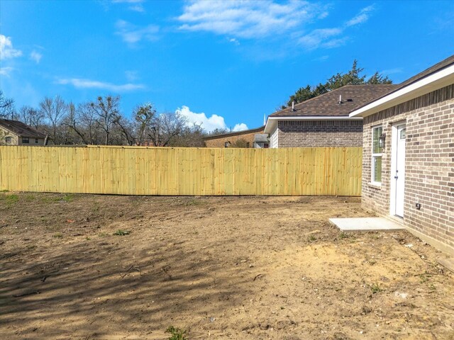 view of yard featuring fence