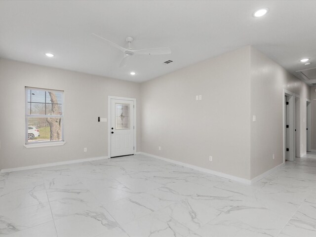 empty room with visible vents, baseboards, recessed lighting, marble finish floor, and a ceiling fan