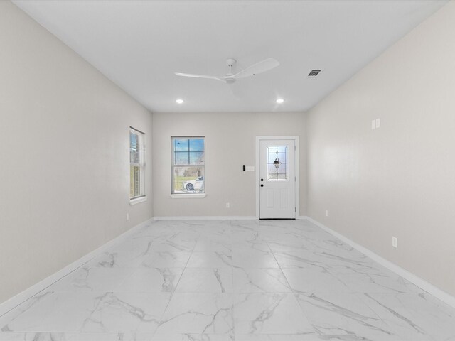 empty room with recessed lighting, visible vents, ceiling fan, and baseboards