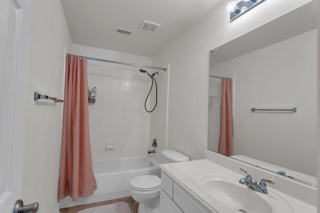 bathroom with visible vents, toilet, vanity, and shower / bathtub combination with curtain