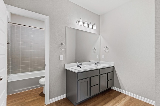 1504 Pleasant Knoll Trl, Aubrey, TX 76227 - full bathroom with toilet, wood finished floors, baseboards, and a sink