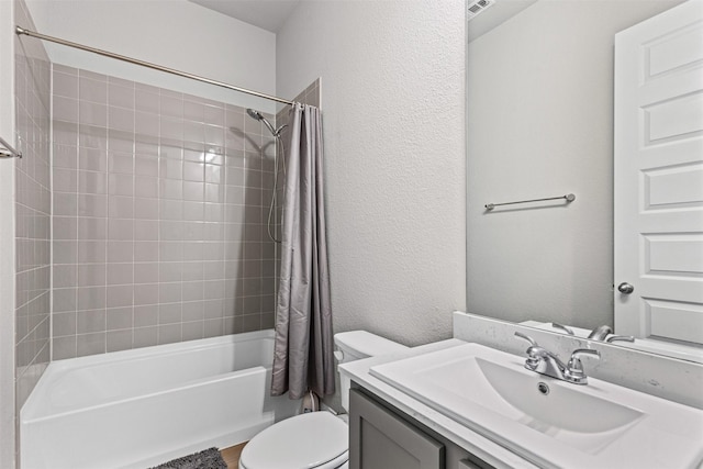 1504 Pleasant Knoll Trl, Aubrey, TX 76227 - bathroom featuring toilet, shower / bath combo with shower curtain, vanity, and a textured wall