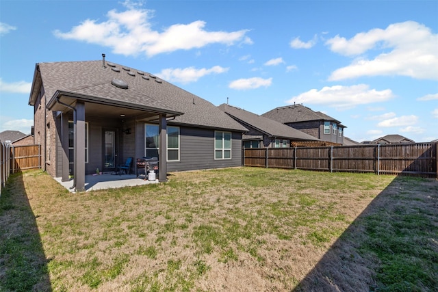 1504 Pleasant Knoll Trl, Aubrey, TX 76227 - back of property with a patio area, a lawn, a shingled roof, and a fenced backyard