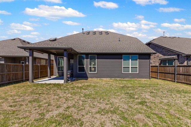 1504 Pleasant Knoll Trl, Aubrey, TX 76227 - back of property featuring a patio area, a yard, a fenced backyard, and roof with shingles