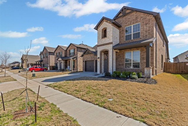 1504 Pleasant Knoll Trl, Aubrey, TX 76227 - view of front facade featuring a front lawn, driveway, fence, a garage, and brick siding