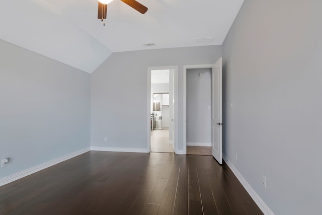 unfurnished bedroom with a ceiling fan, baseboards, visible vents, lofted ceiling, and dark wood-style flooring