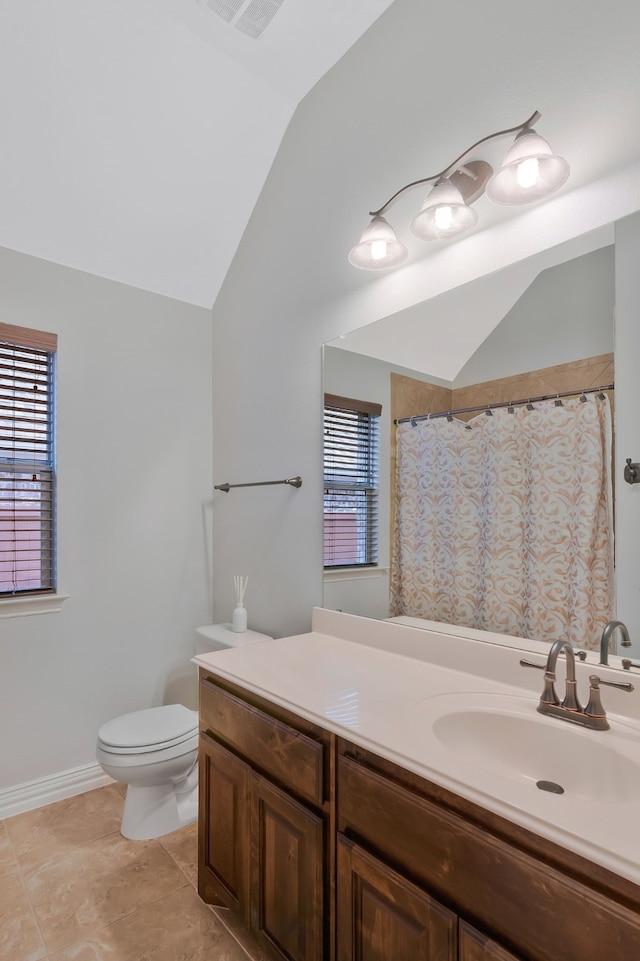 full bath with visible vents, toilet, tile patterned flooring, lofted ceiling, and vanity