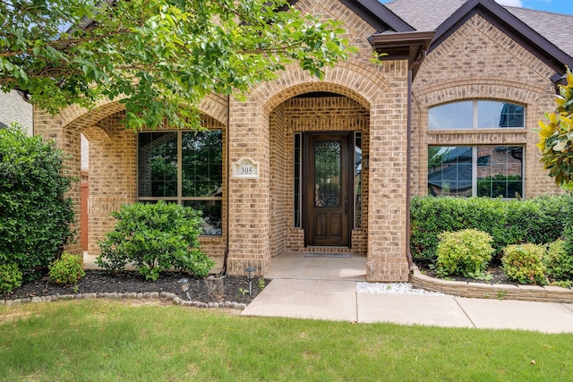 305 Dorset Ct, Roanoke, TX 76262 - property entrance featuring brick siding and roof with shingles