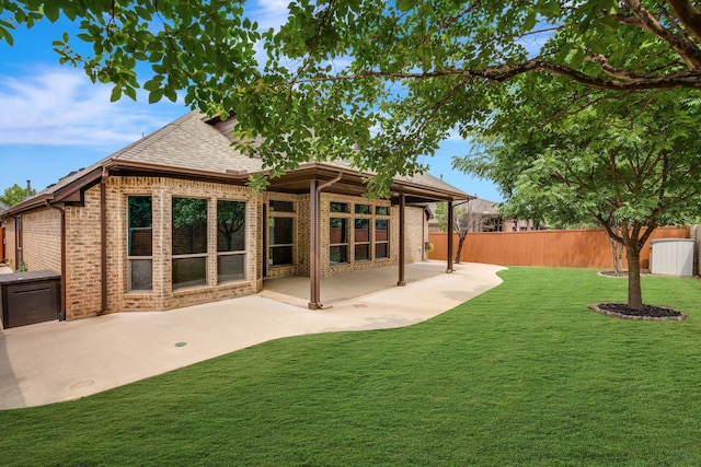 305 Dorset Ct, Roanoke, TX 76262 - rear view of house featuring brick siding, a patio area, and roof with shingles