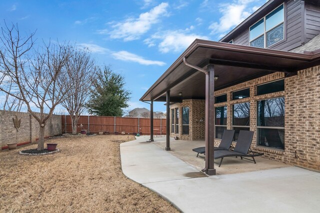 view of yard with a fenced backyard and a patio area