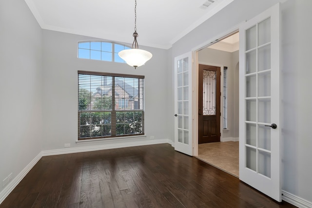 interior space featuring wood finished floors, visible vents, baseboards, french doors, and crown molding