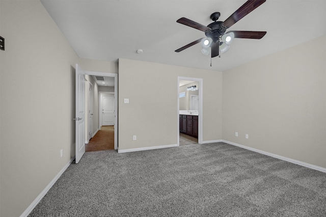 unfurnished bedroom with visible vents, light colored carpet, baseboards, and ceiling fan