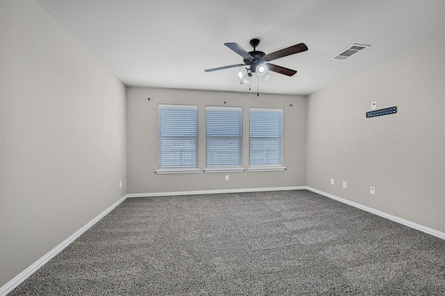 unfurnished room featuring visible vents, baseboards, carpet floors, and a ceiling fan