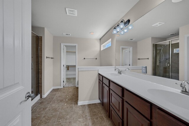 full bath featuring a sink, visible vents, and a stall shower