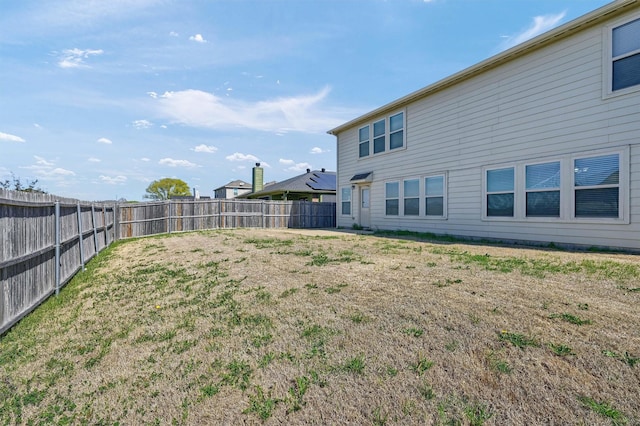 view of yard with a fenced backyard