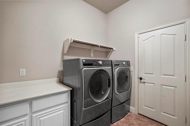 laundry room with washer and dryer and cabinet space