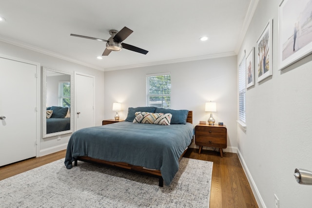 bedroom with wood finished floors, baseboards, recessed lighting, ceiling fan, and crown molding