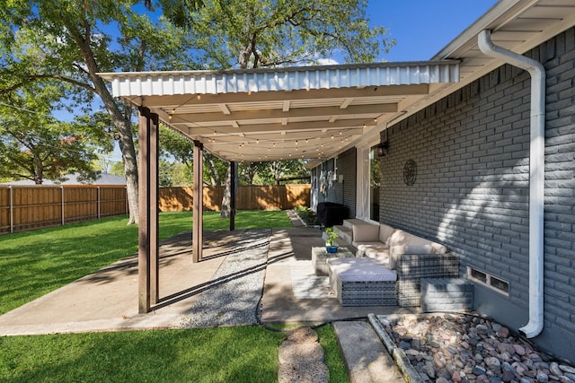 view of patio / terrace with an outdoor living space and a fenced backyard