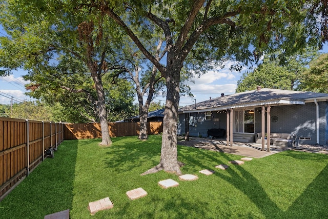 view of yard featuring a patio and a fenced backyard