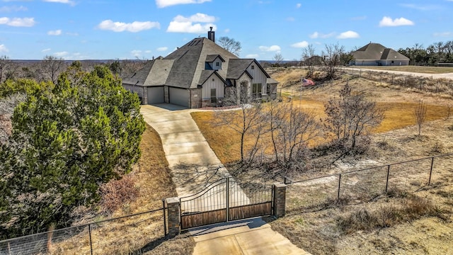 2001 Adams Overlook, Weatherford, TX 76088 - view of front of home featuring fence, board and batten siding, concrete driveway, and an attached garage