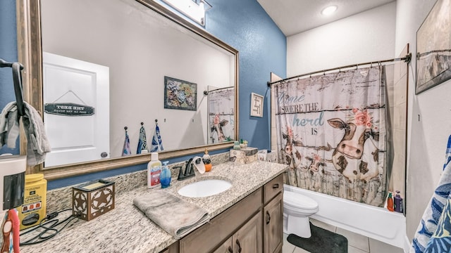 bathroom with toilet, shower / bath combo with shower curtain, a textured wall, tile patterned floors, and vanity