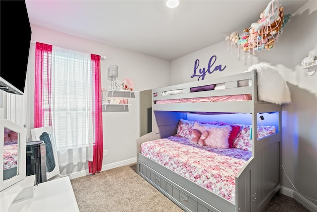 bedroom featuring baseboards and carpet floors