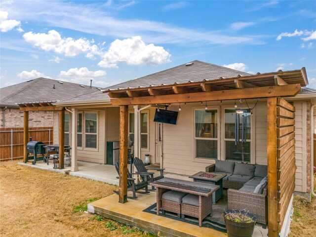 rear view of house featuring a shingled roof, an outdoor living space with a fire pit, a patio, and fence