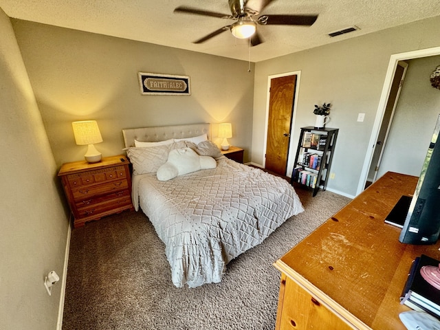 bedroom featuring baseboards, visible vents, carpet floors, ceiling fan, and a textured ceiling