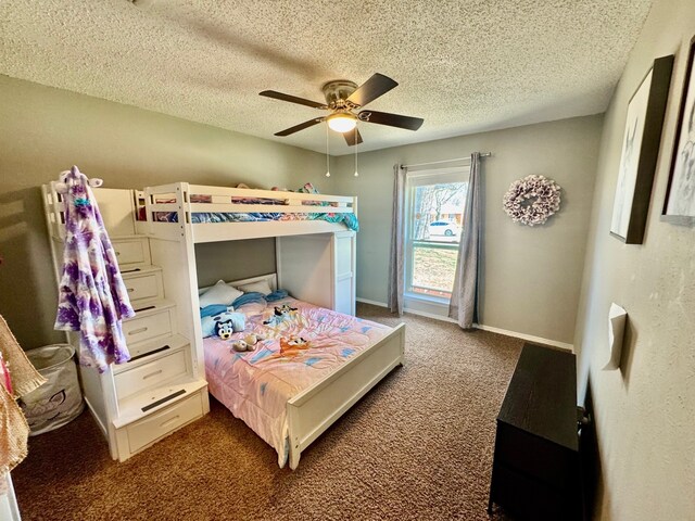 bedroom featuring ceiling fan, carpet flooring, baseboards, and a textured ceiling