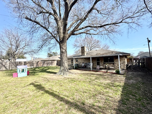 view of yard featuring a patio and a fenced backyard