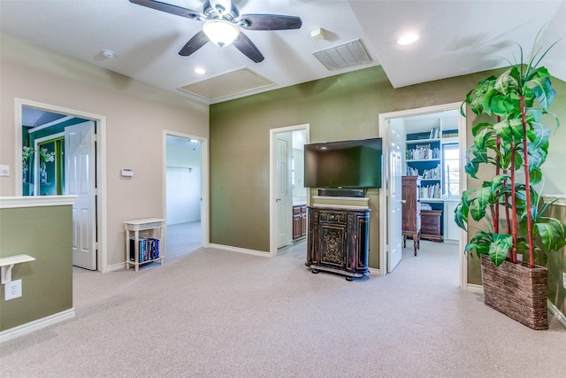 living room with baseboards, visible vents, carpet floors, attic access, and recessed lighting