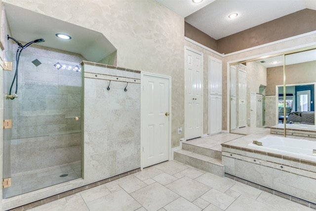 full bathroom featuring a garden tub and a stall shower