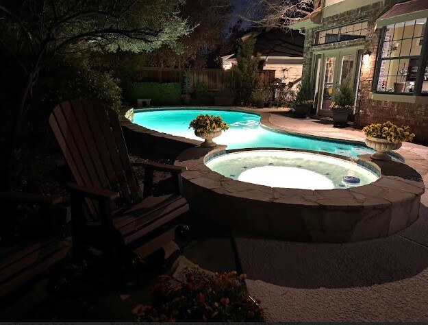 view of swimming pool with an in ground hot tub and a fenced in pool