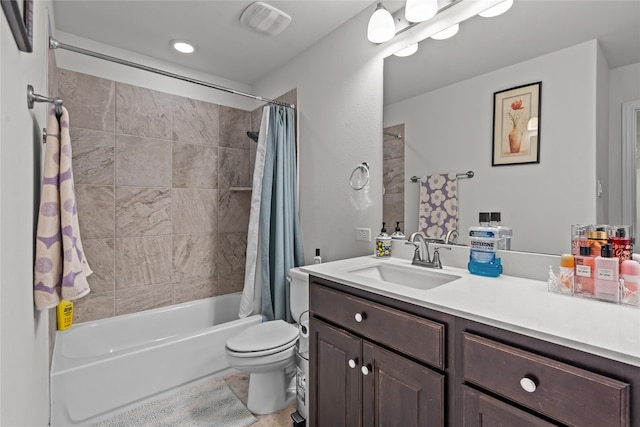 full bathroom featuring vanity, shower / tub combo, toilet, and visible vents