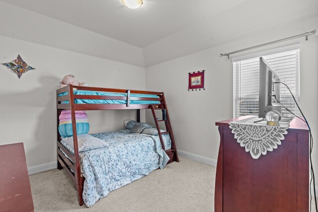 carpeted bedroom featuring baseboards