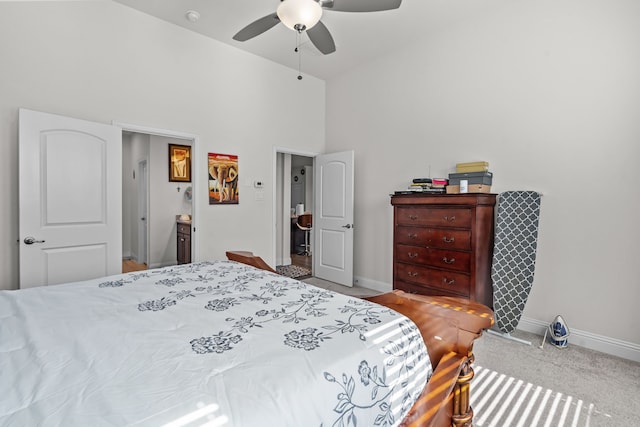 bedroom featuring baseboards, a high ceiling, carpet floors, and ceiling fan