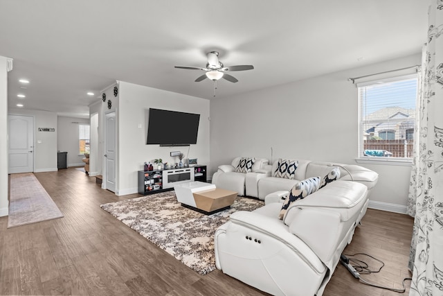 living room featuring recessed lighting, wood finished floors, baseboards, and ceiling fan