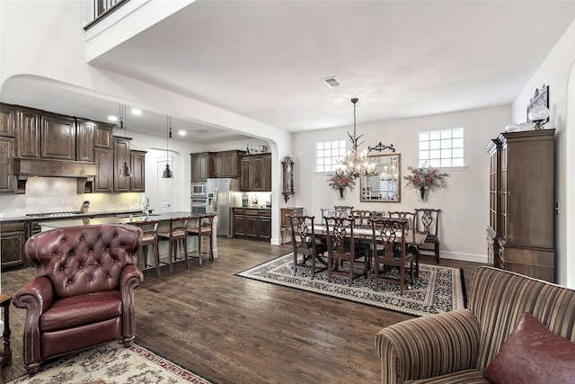 living room with recessed lighting, dark wood-style floors, baseboards, and a chandelier