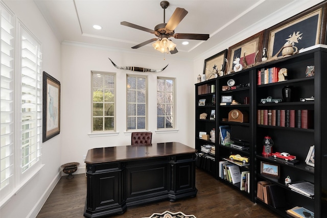 office space with crown molding, a ceiling fan, and dark wood-style flooring